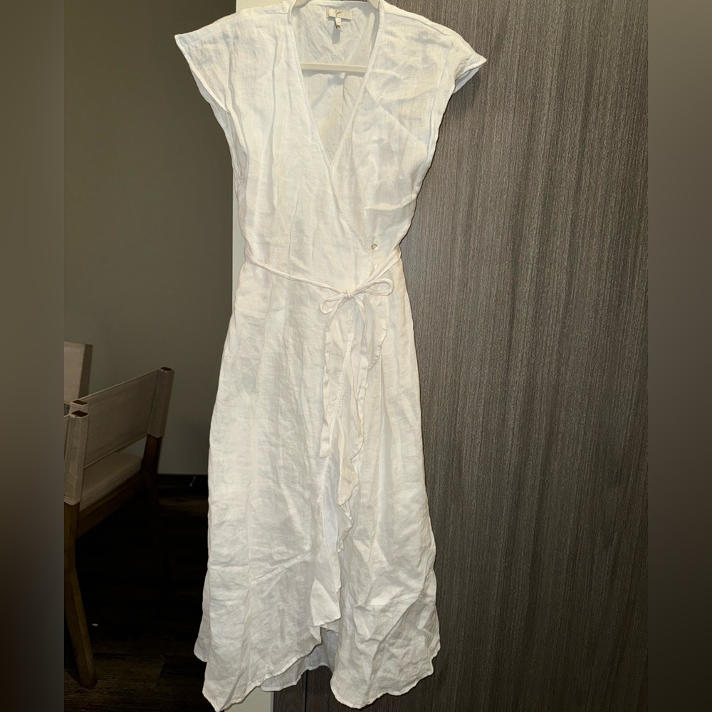 White, open back, long ruffle dress.